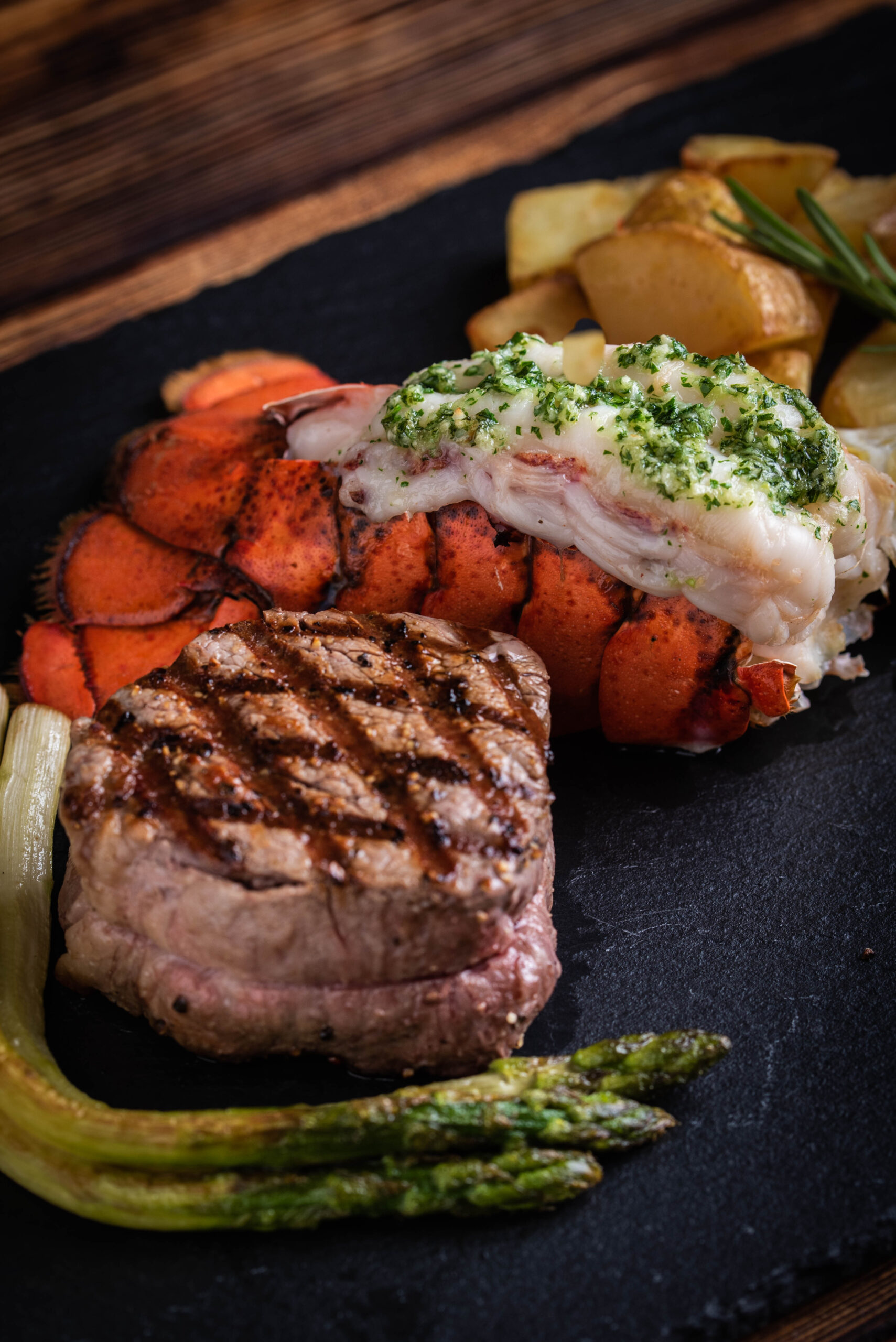 surf and turf on black stone plate