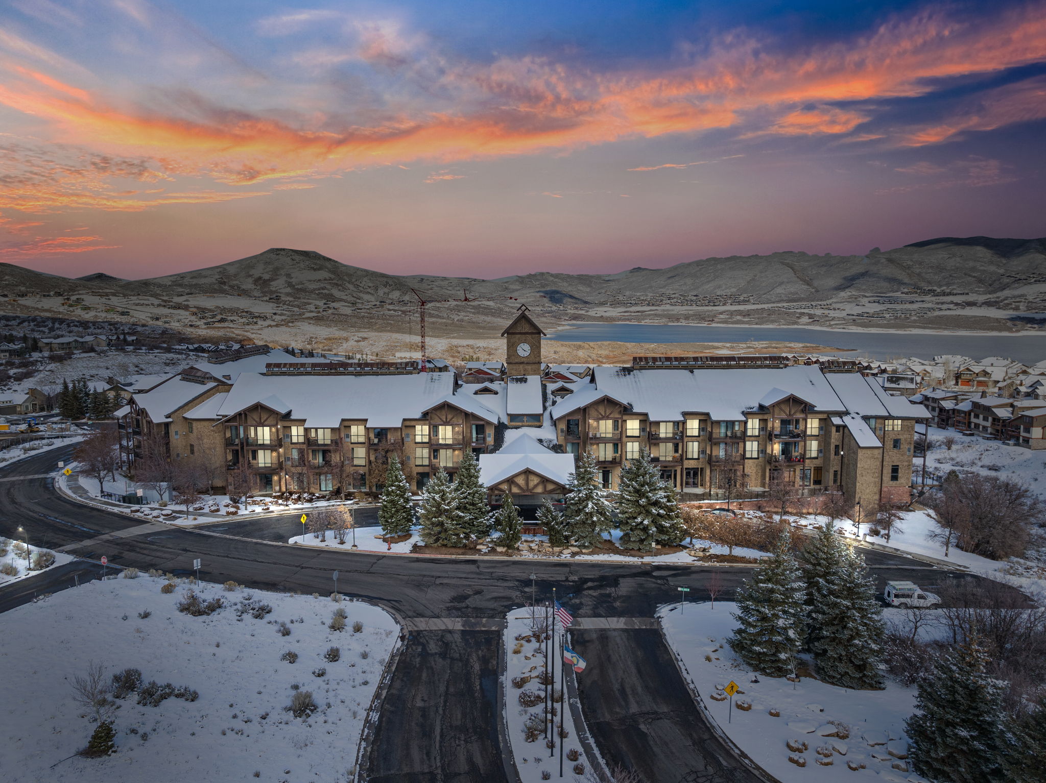 view of the mason condo complex with the jordanelle reservoir and mountains in the background in Deer Valley