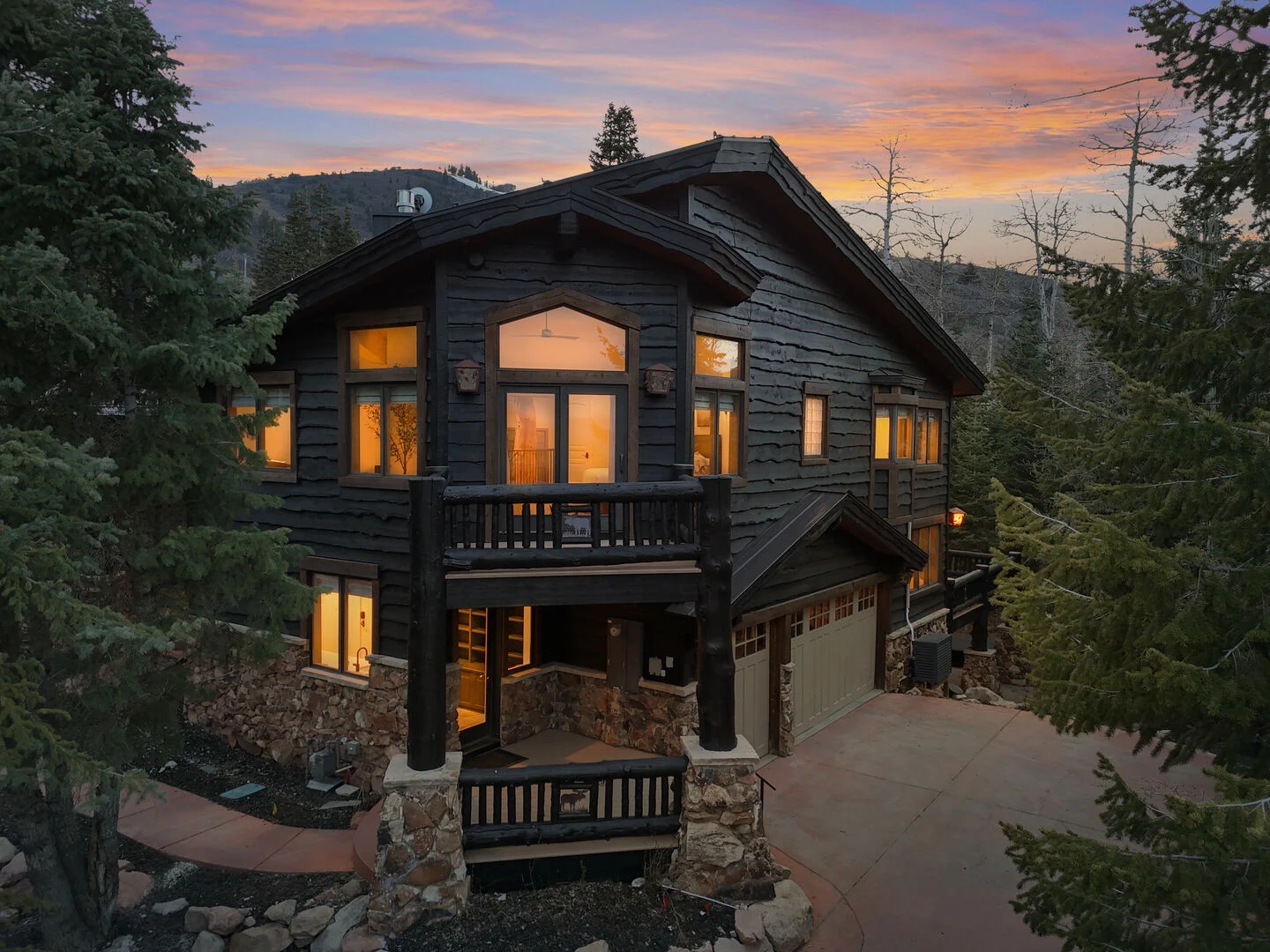 Red Pine at the canyons at sunset. you can see the mountains and forest in the background and lights glowing from inside the house. Red Pine at the canyons at sunset. you can see the mountains and forest in the background and lights glowing from inside the house.