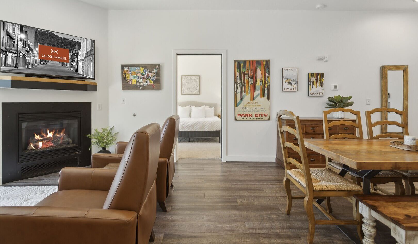 The living space of The Mason 1052 with cozy seating and a fireplace and great views