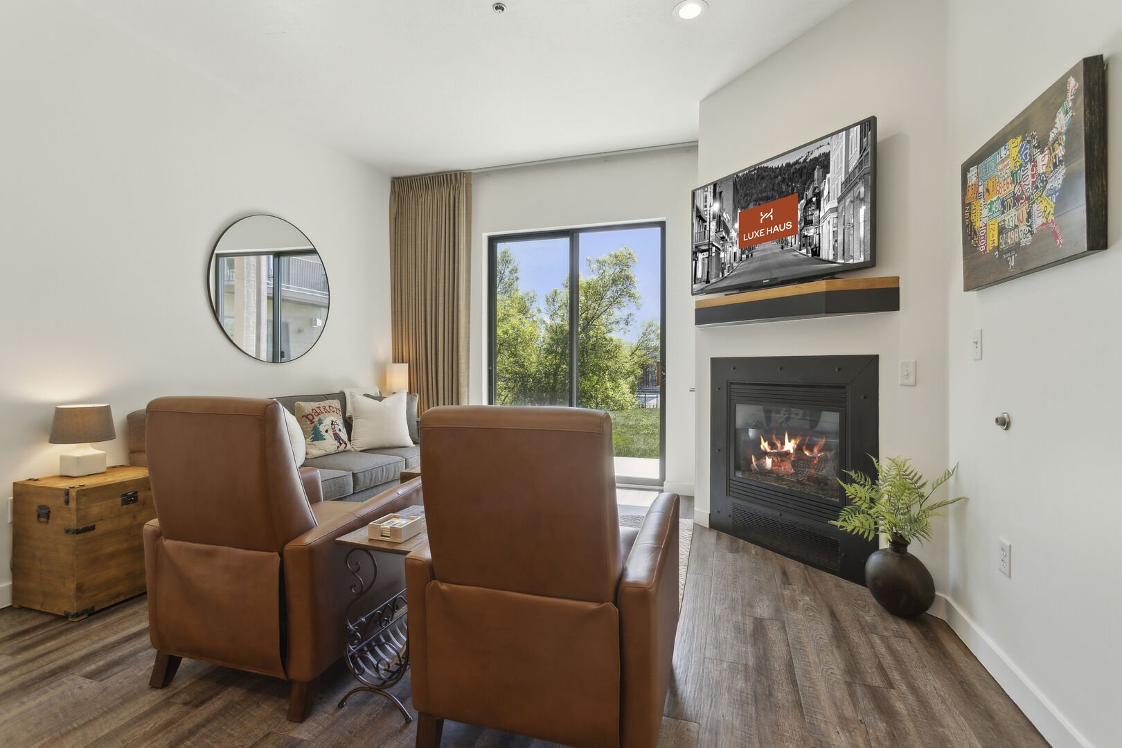 the mason 1052 living area with fireplace, flat screen tv, and great views