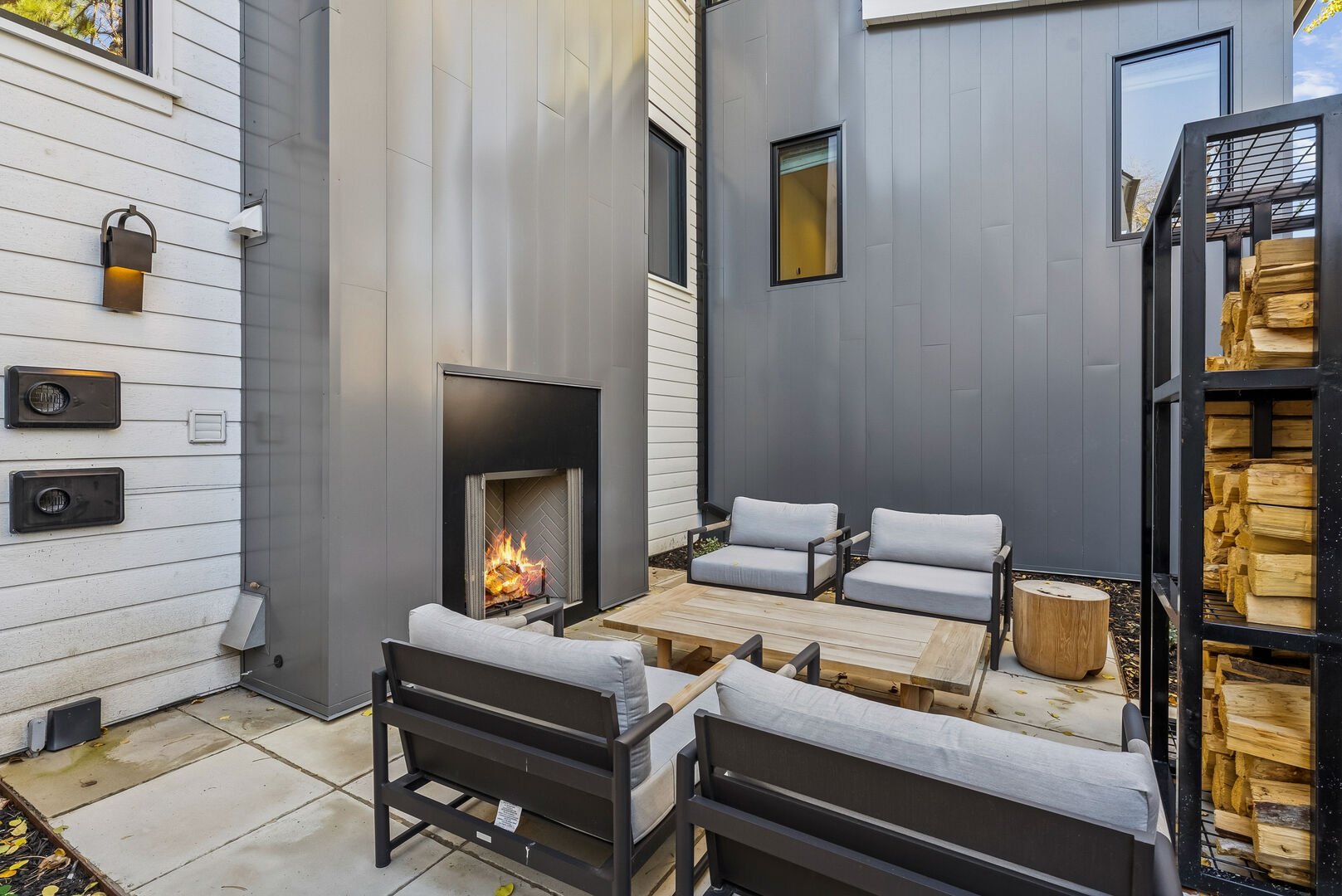 The outdoor firepit and modern designer seating area at Crescent House at Old Town in Park City
