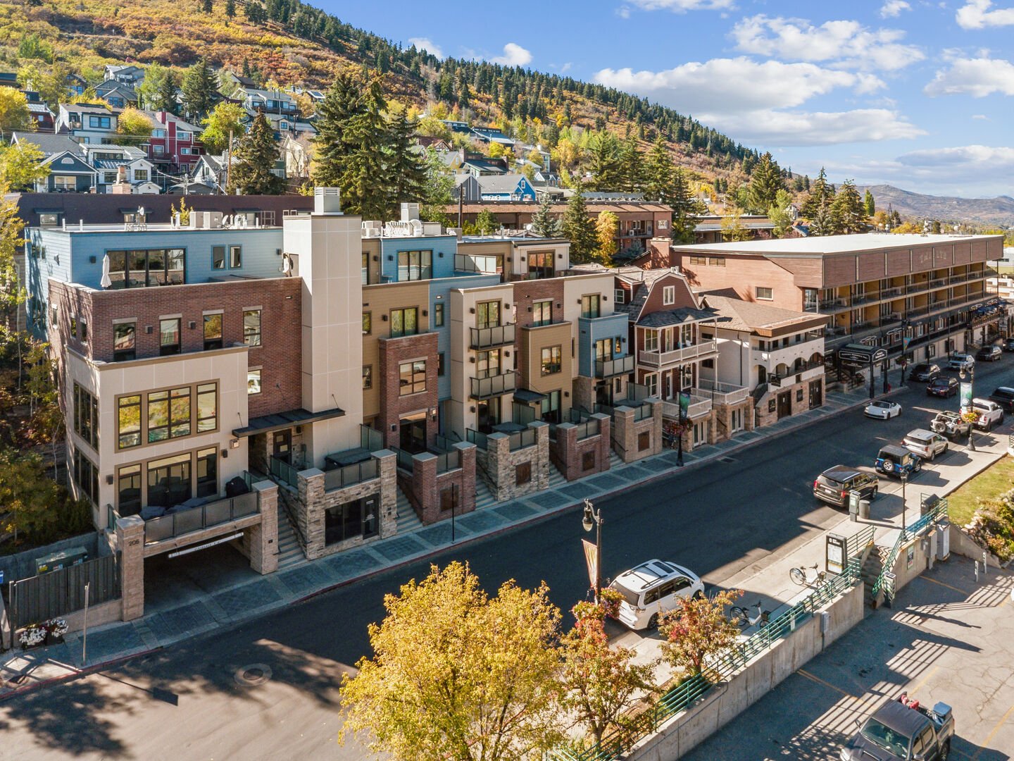 views of old town and the mountains of park city with main street modern in the center of the image