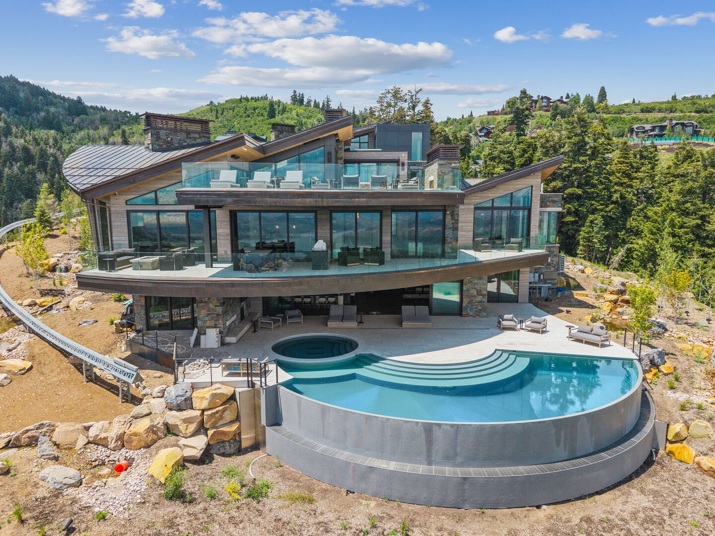 the view of mountainhead and the slopes of deer valley behind the home