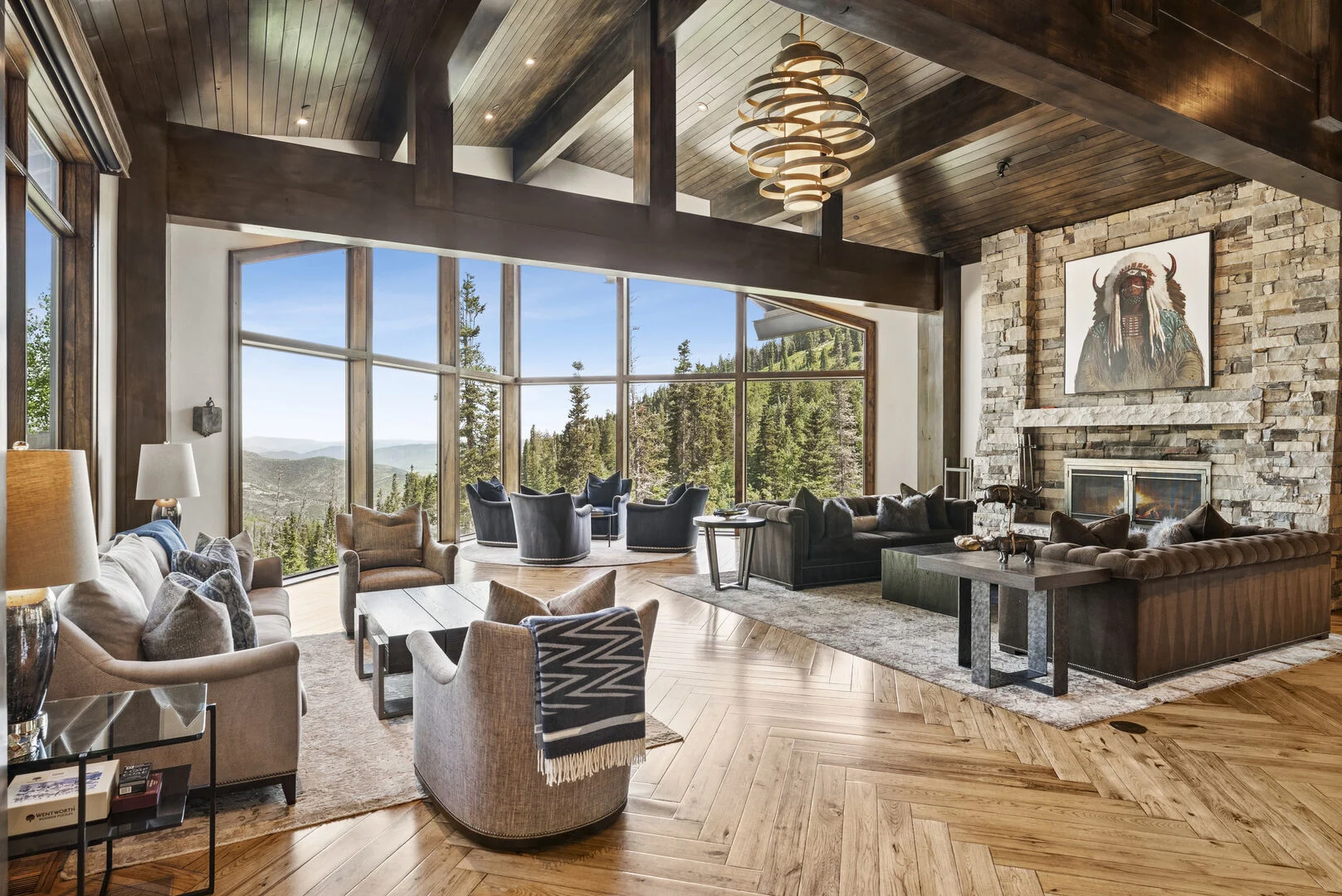 the stunning living room at grandview with sweeping 180 degree views of the mountains of park city