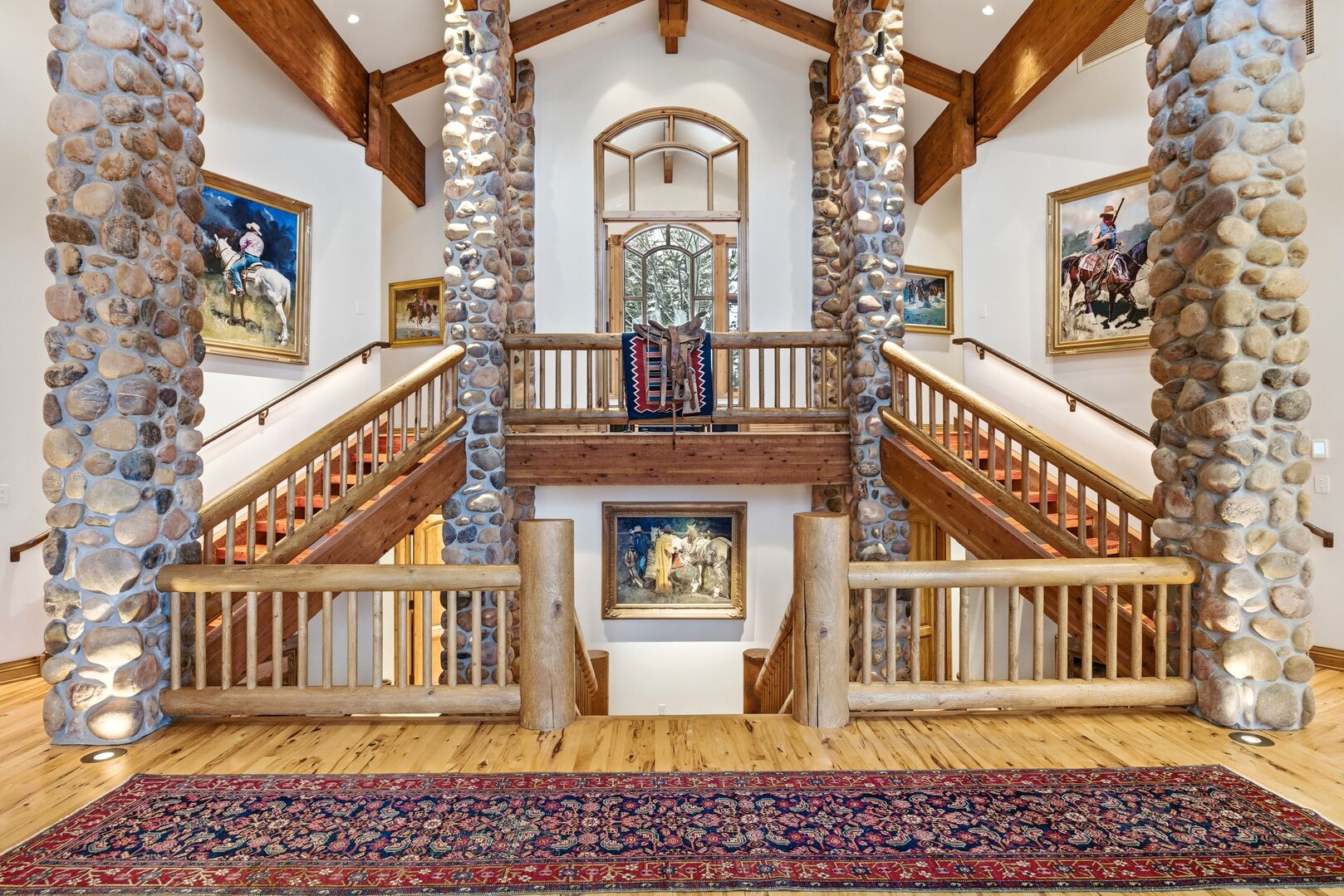 the magnificent towering stone pillars inside the deer valley home summit view lodge with authentic native american artwork and warm lighting