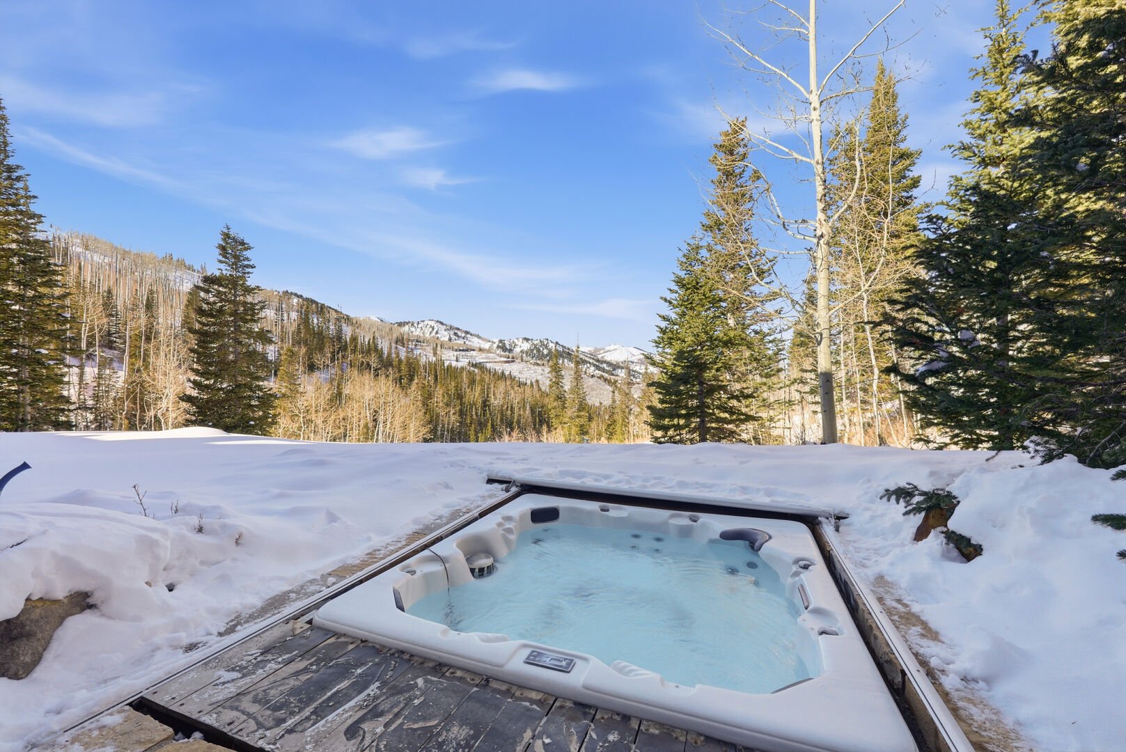 snowy mountain views of park city from the hot tub at Snow Dance