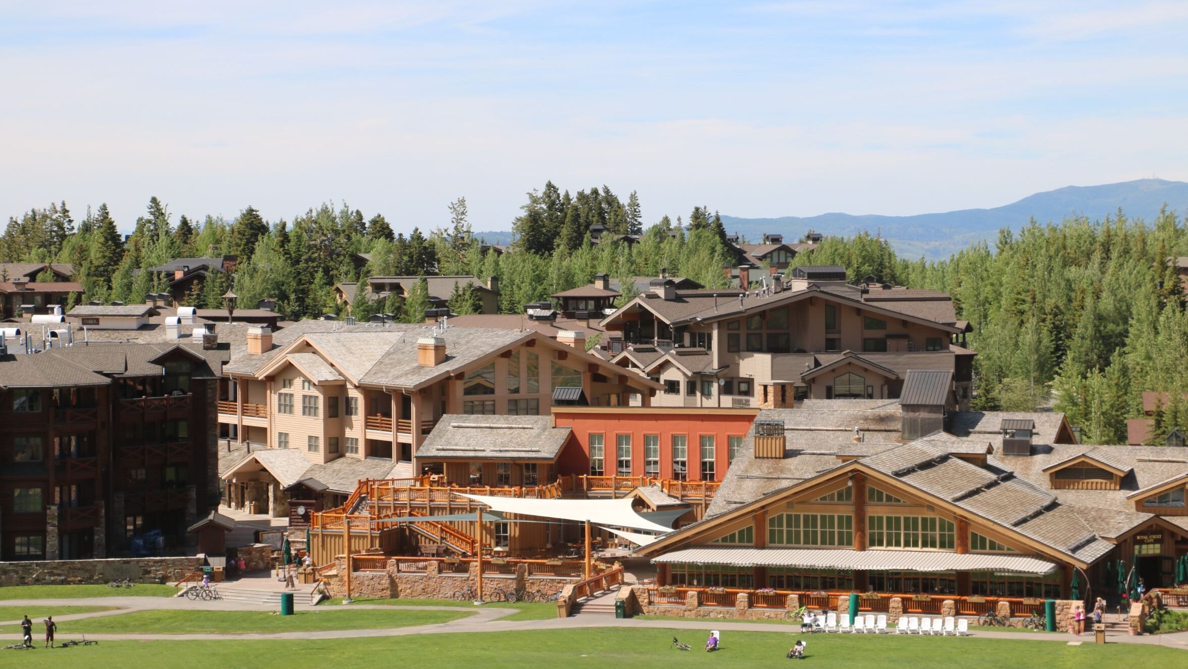 A view of stunning Deer Valley in spring, with stunning vistas and gorgeous greenery in the background. Deer Vally is home to the best luxury condo rentals managed by Luxe Haus