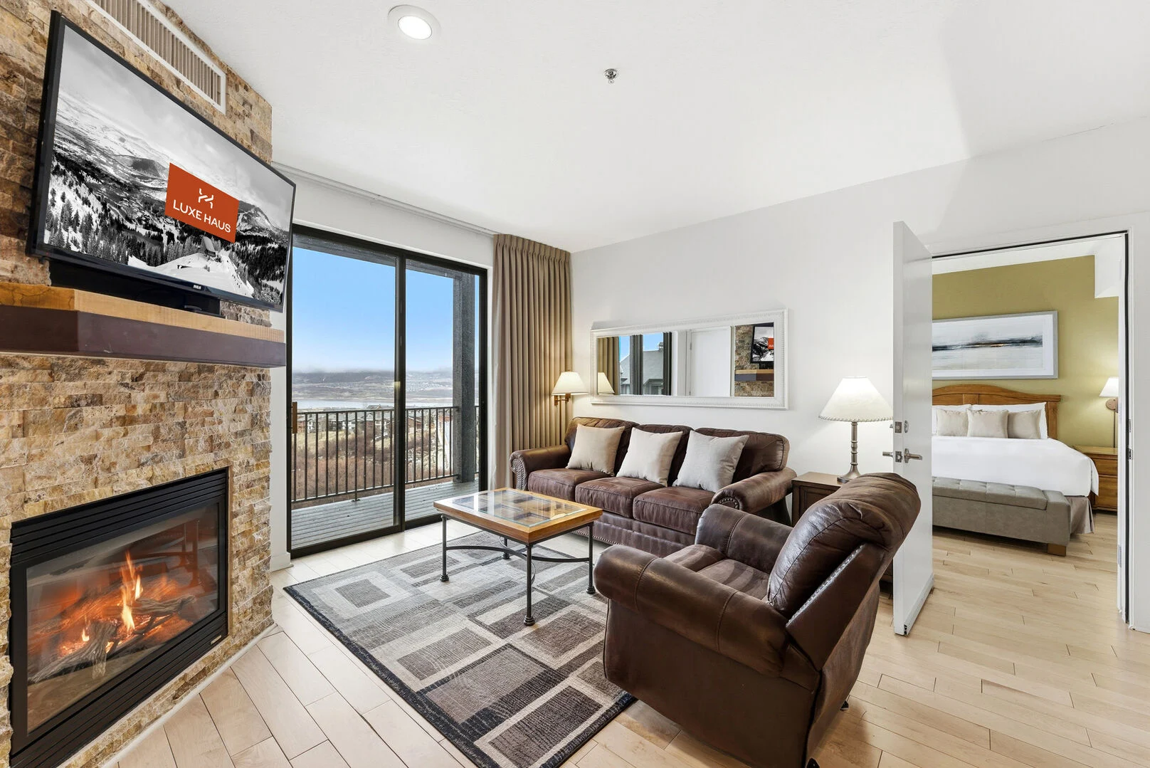 The living area at The Mason 3020 with cozy fireplace and deer valley views