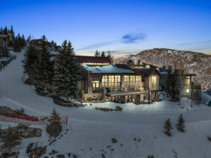 Snow pine at deer valley at sundown with the ski run visible in front of the home