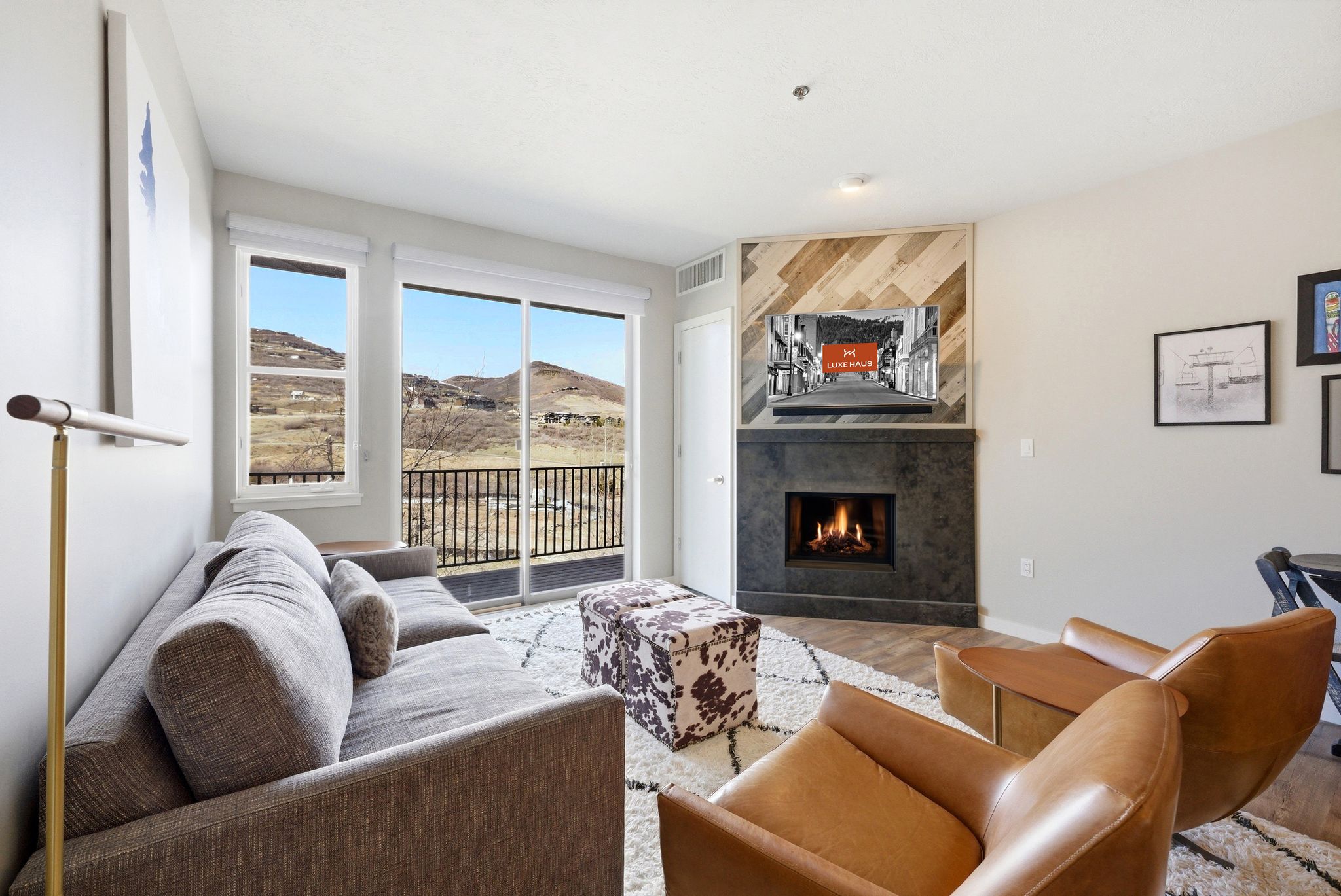 The luxury living area at The Mason with modern fireplace and flat screen TV