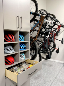 a well organized gear closet with bikes and helmets