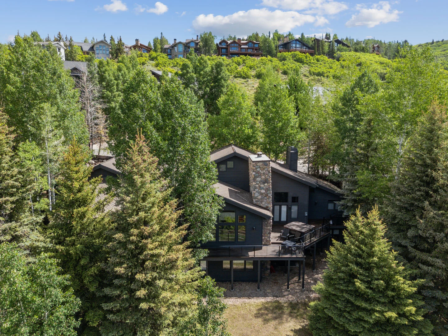 Deer Valley Bliss surrounded by trees i the mountains of deer valley utah